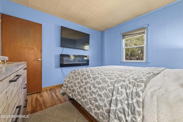 bedroom with wood finished floors