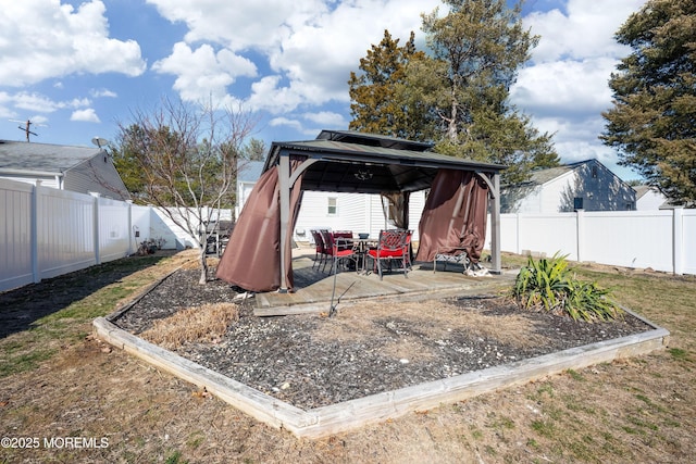 view of yard featuring a gazebo, a patio area, and a fenced backyard