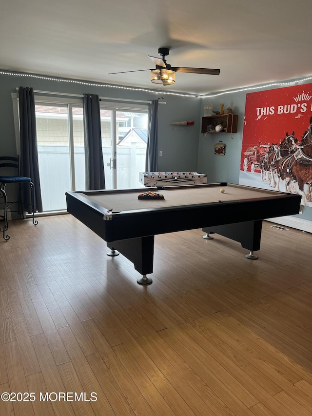 recreation room with billiards, ceiling fan, and wood finished floors