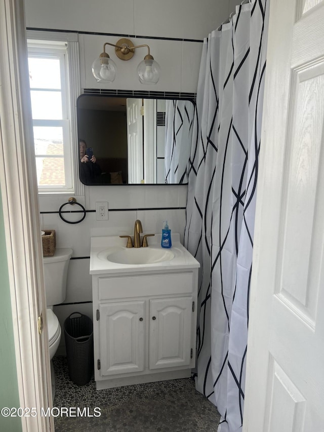 full bathroom with vanity and toilet