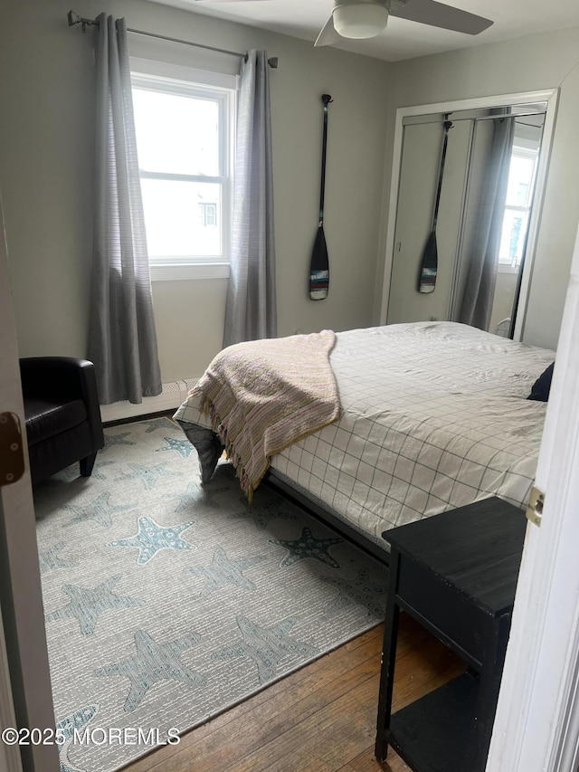 bedroom featuring a ceiling fan and wood finished floors