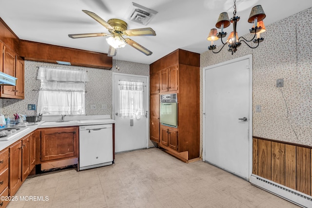 kitchen with visible vents, a baseboard heating unit, oven, light floors, and dishwasher