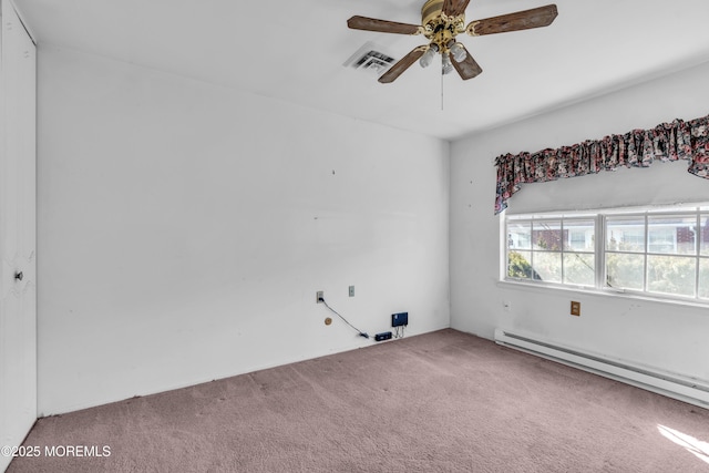 carpeted empty room featuring visible vents, ceiling fan, and a baseboard radiator