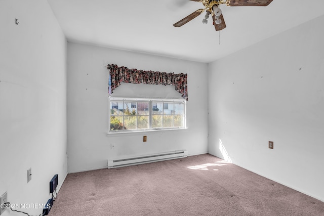 spare room with ceiling fan, baseboard heating, and carpet floors