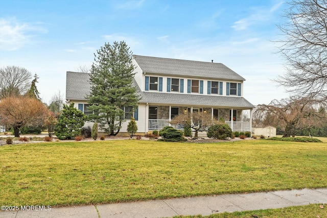 colonial house with a front lawn, covered porch, and a shingled roof