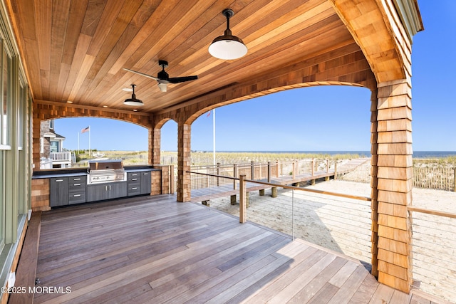 exterior space with grilling area and ceiling fan