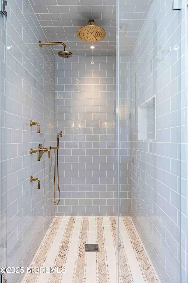 full bathroom with a tile shower