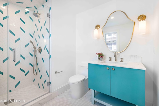 bathroom with a shower stall, toilet, and vanity