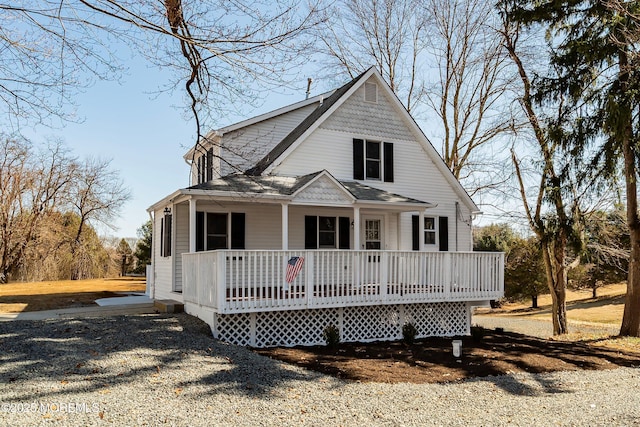 view of front of house with a porch and roof with shingles