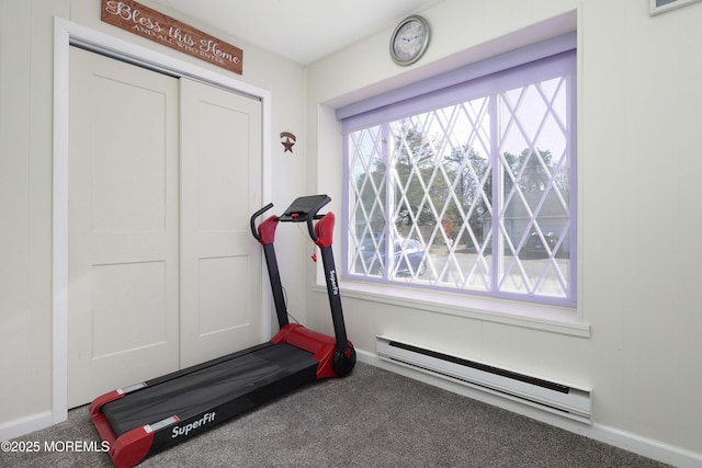 workout area with carpet, baseboards, and a baseboard radiator