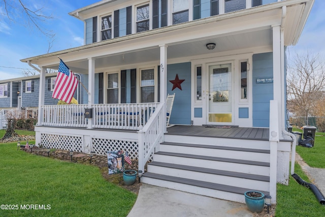 property entrance featuring a porch