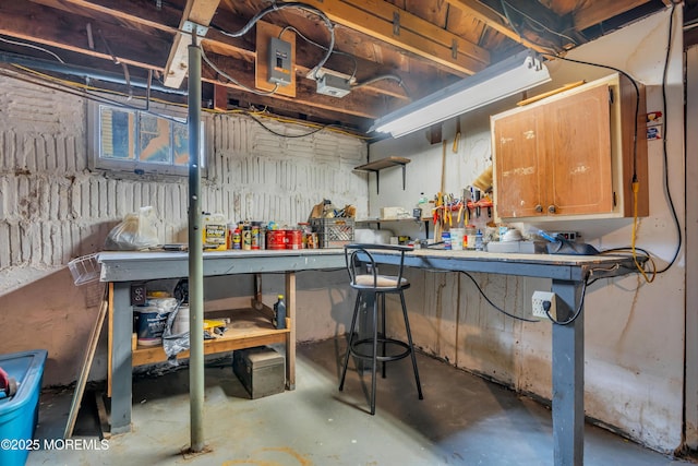 unfinished basement with a workshop area