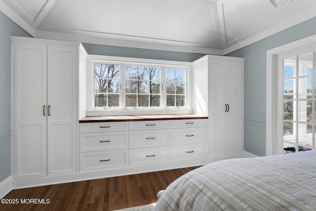 bedroom featuring vaulted ceiling, visible vents, and dark wood-type flooring