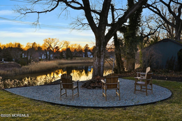 patio terrace at dusk with a water view