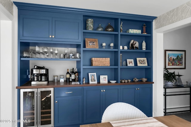 bar featuring wine cooler and a dry bar