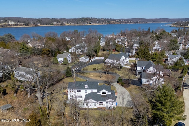 birds eye view of property featuring a residential view and a water view