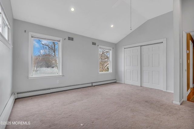 unfurnished bedroom featuring a closet, carpet flooring, visible vents, and baseboard heating