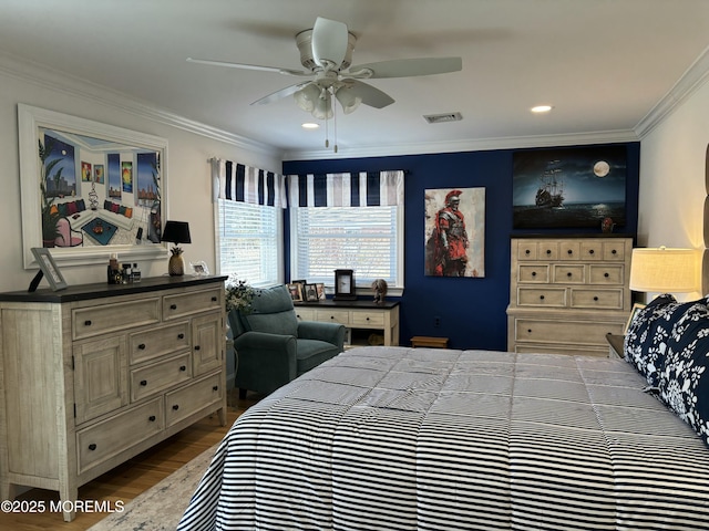 bedroom with recessed lighting, wood finished floors, visible vents, and ornamental molding