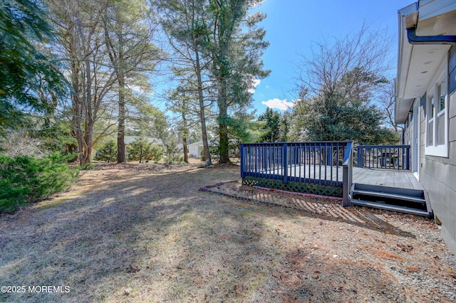 view of yard with a wooden deck