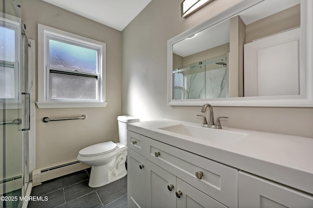 bathroom featuring vanity, a baseboard radiator, a shower stall, a baseboard heating unit, and toilet