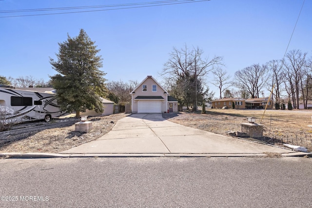 view of front of property featuring a garage and driveway