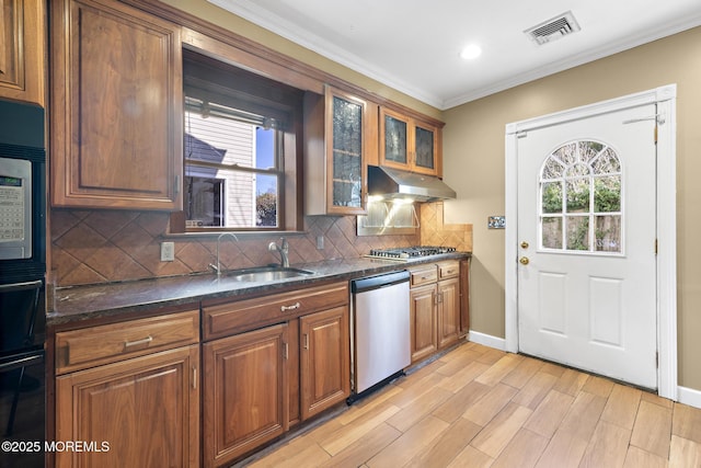 kitchen featuring visible vents, ornamental molding, under cabinet range hood, stainless steel appliances, and a healthy amount of sunlight