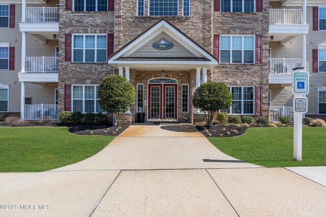view of building exterior with driveway