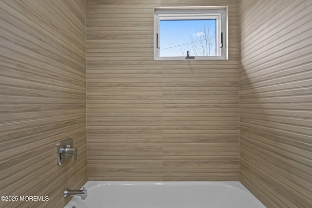 bathroom with shower / bath combination