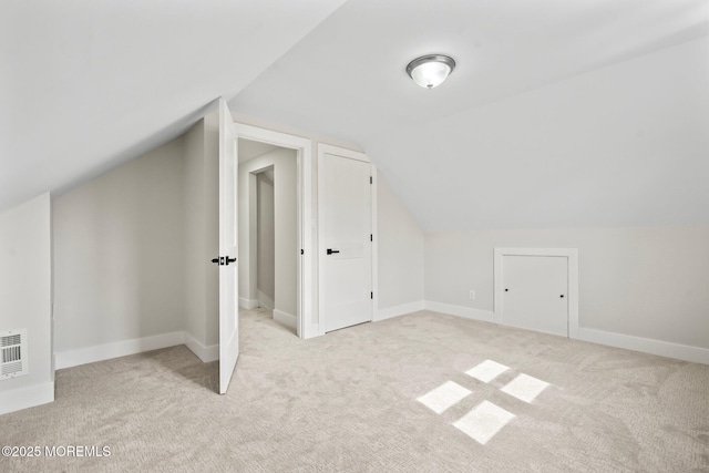 bonus room with vaulted ceiling, carpet flooring, and baseboards