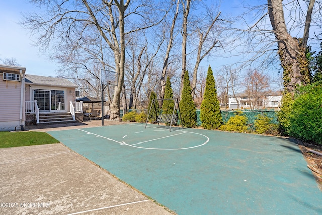 view of basketball court featuring community basketball court and fence