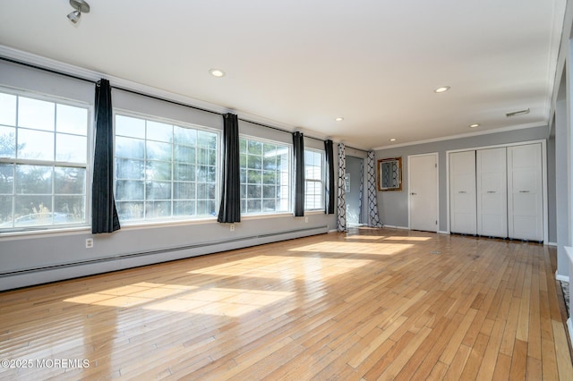 unfurnished living room featuring visible vents, light wood-style flooring, recessed lighting, crown molding, and baseboard heating