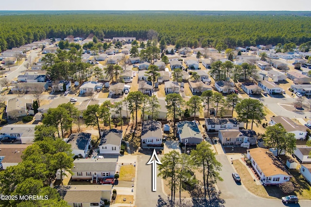 aerial view featuring a residential view and a view of trees