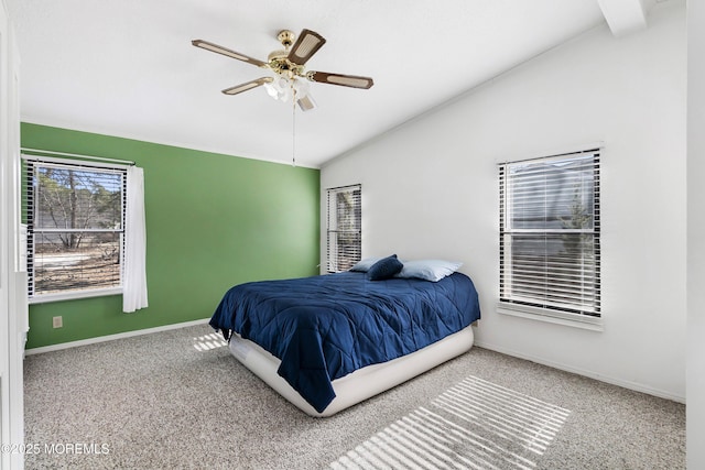 carpeted bedroom with baseboards, lofted ceiling, and a ceiling fan