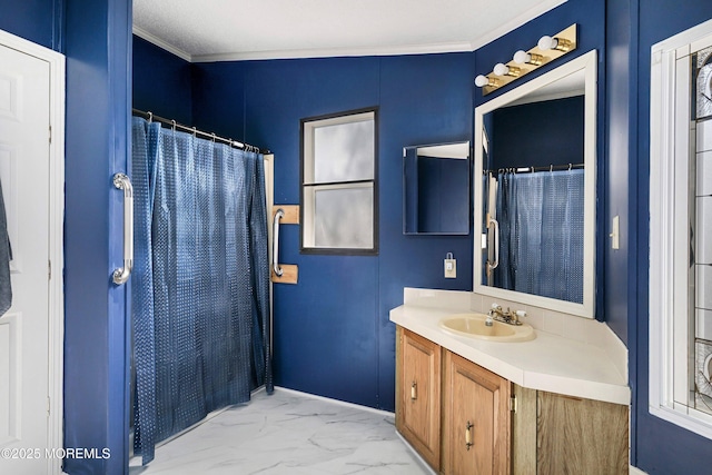 bathroom with a shower with curtain, vanity, marble finish floor, and crown molding