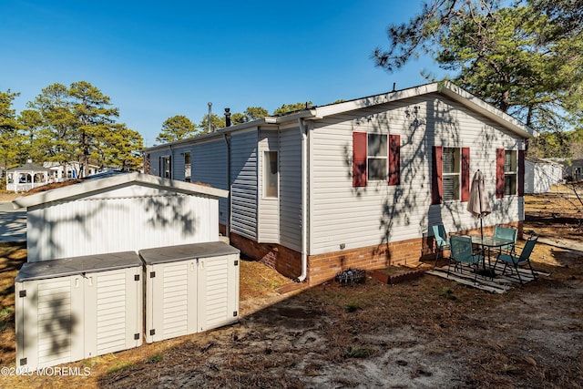 exterior space with an outdoor structure and a shed