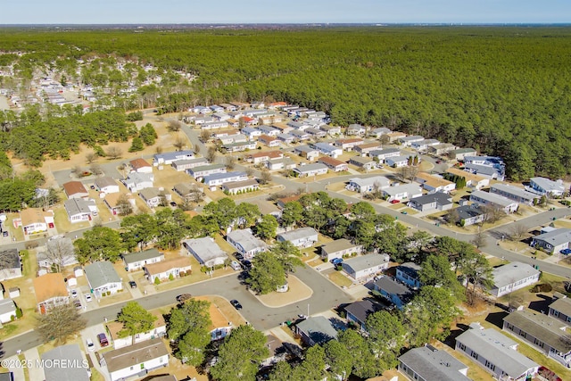 birds eye view of property with a residential view and a view of trees