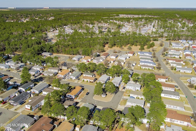 birds eye view of property with a residential view