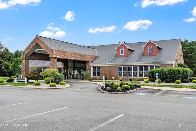 view of property featuring uncovered parking