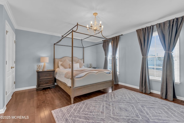 bedroom featuring a notable chandelier, ornamental molding, baseboards, and wood-type flooring