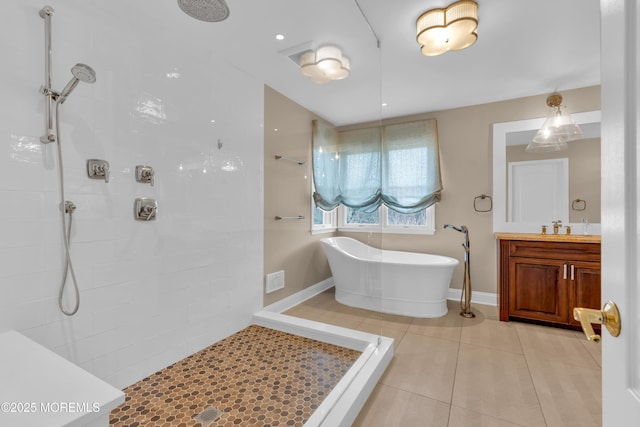 full bathroom with tile patterned floors, tiled shower, and a freestanding tub