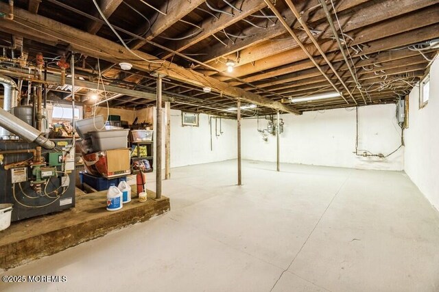 basement featuring a heating unit