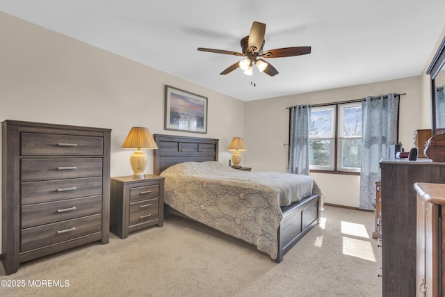 bedroom with baseboards, light colored carpet, and a ceiling fan