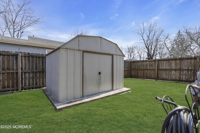 view of shed with a fenced backyard