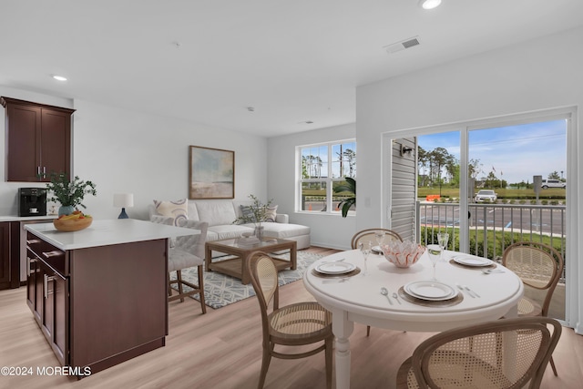 dining area with recessed lighting, visible vents, and light wood-style flooring