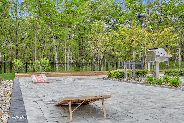 view of patio featuring fence