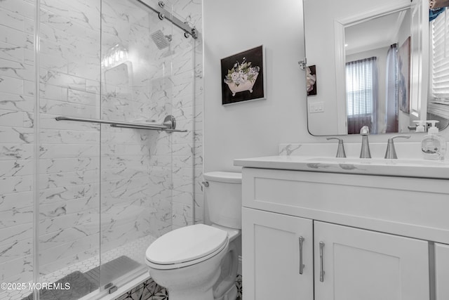 full bathroom with vanity, crown molding, toilet, and a marble finish shower