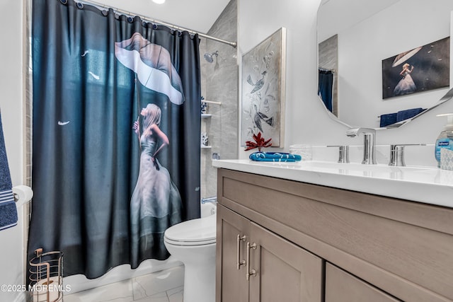 bathroom with toilet, marble finish floor, and vanity