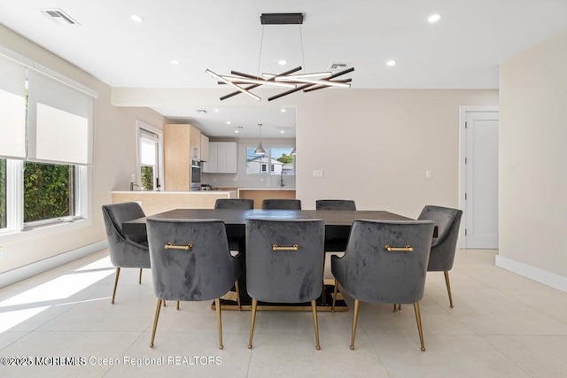 dining area with visible vents, recessed lighting, light tile patterned flooring, baseboards, and a chandelier