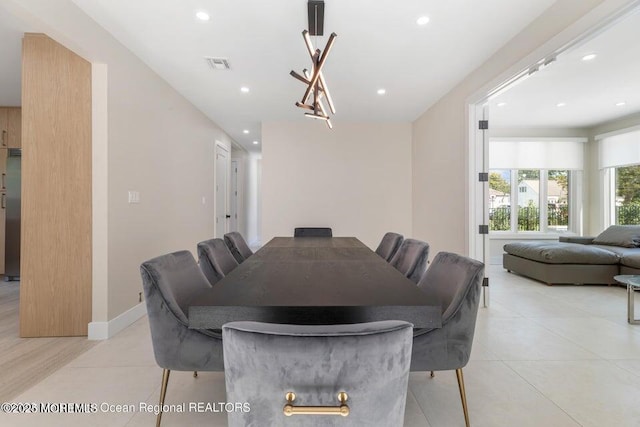 dining room with light tile patterned floors, visible vents, baseboards, and recessed lighting