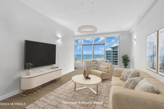 living area featuring baseboards and wood finished floors